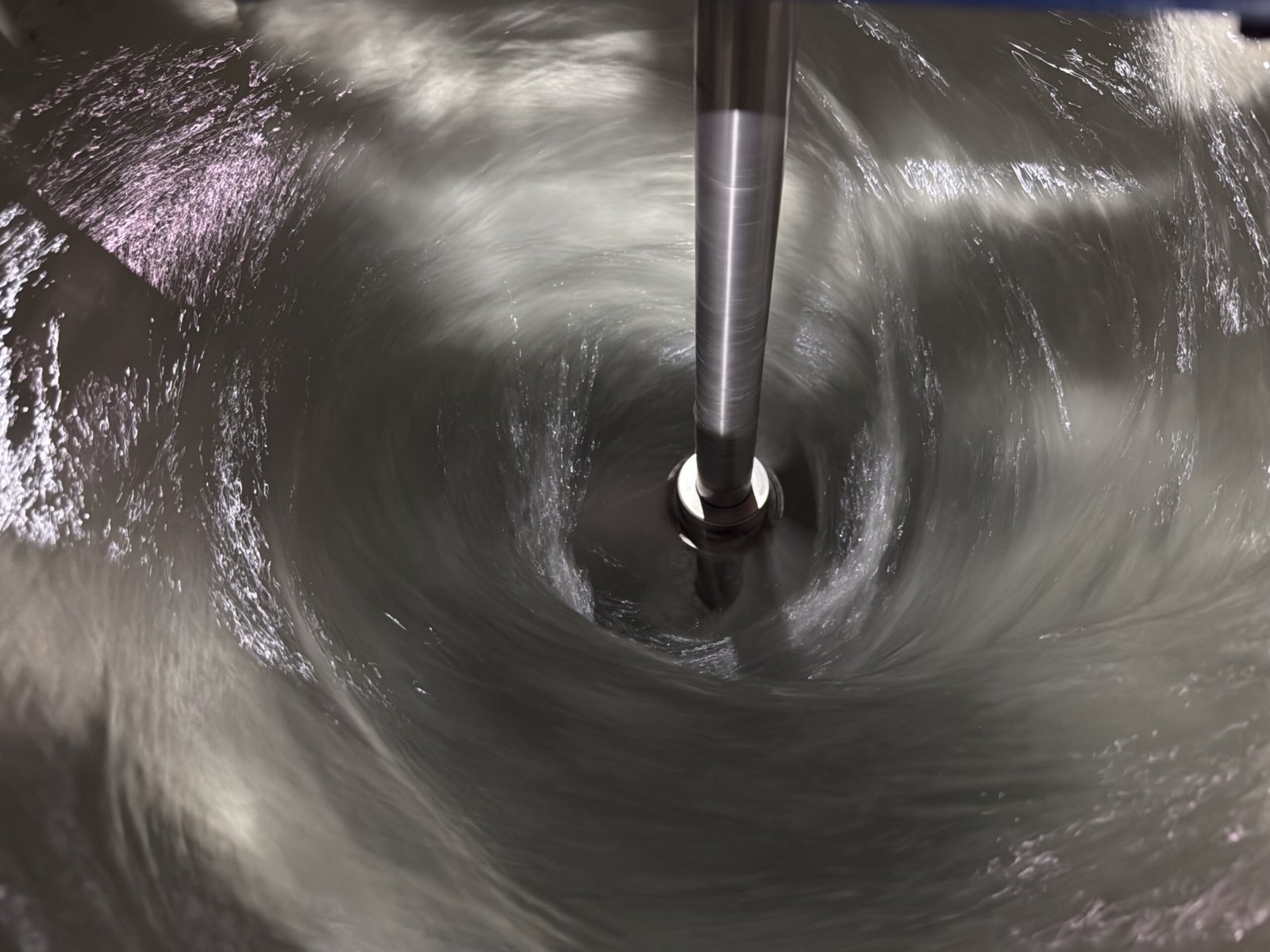 About Us - High-Performance Agitator Mixing Liquid in Industrial Drum